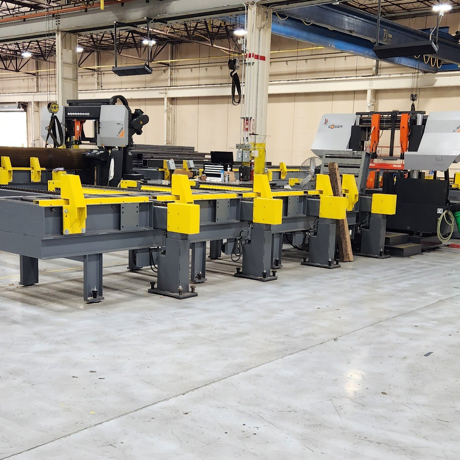 Two Saw system with powered lift transfer arms – Bad Ass Band Saws