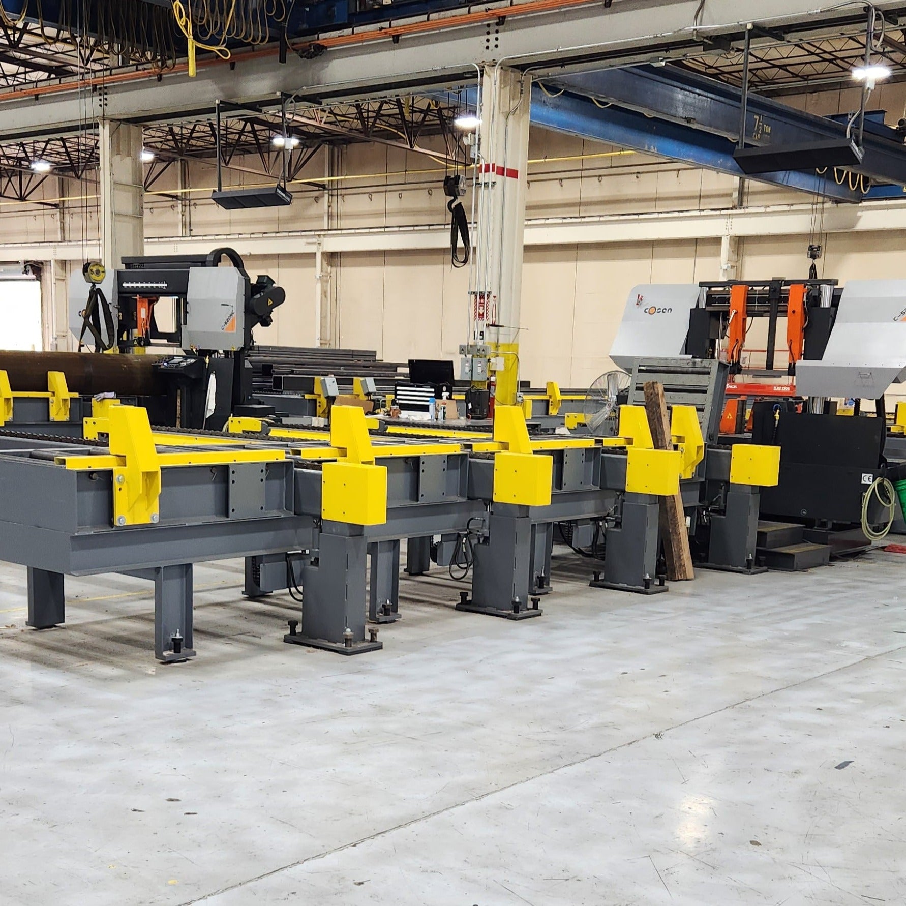 Single Saw system with powered lift transfer arms Bad Ass Band Saws